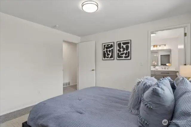 Primary bedroom with ensuite bathroom has been completely remodeled.