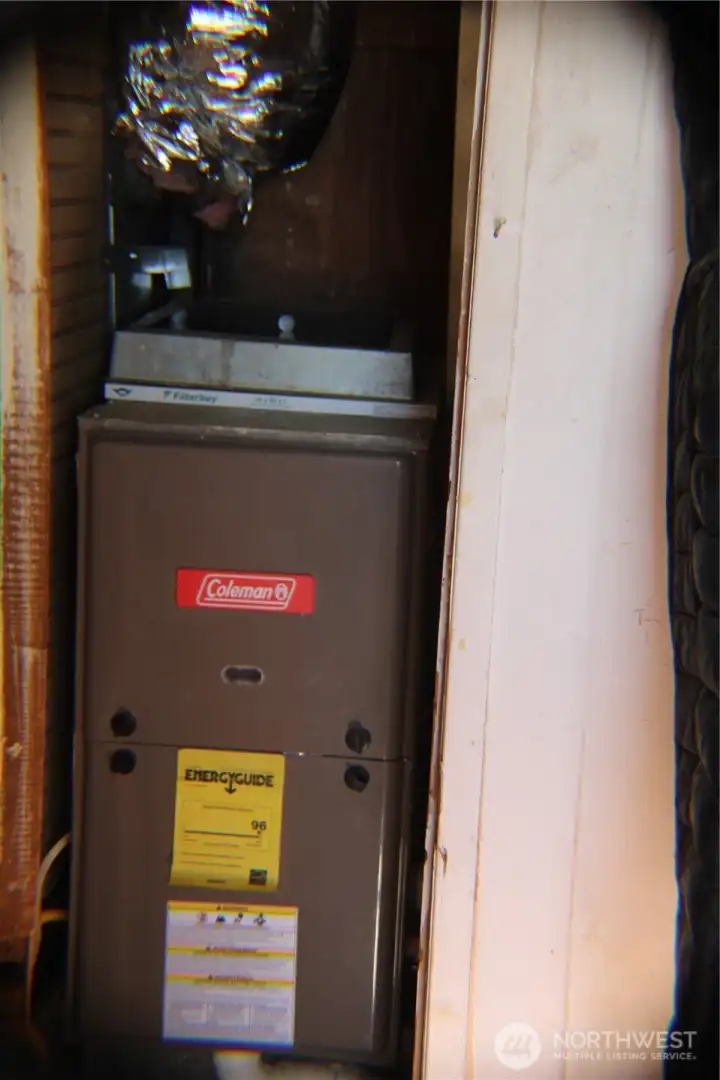 Natural gas furnace, tucked in a closet under the stairs