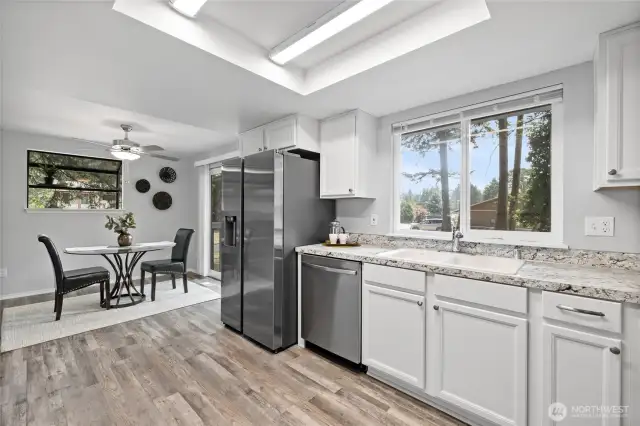 Light and bright kitchen with views of the large back yard.