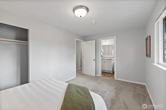 Primary bedroom looking to the adjoining continental/full bathroom.