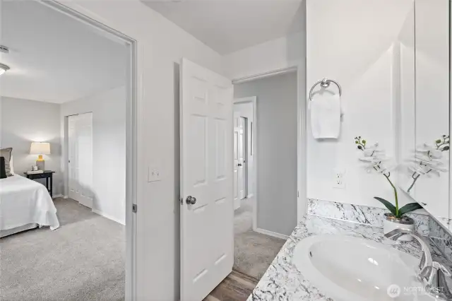 Full/continental offers easy access off both the primary bedroom and hall.