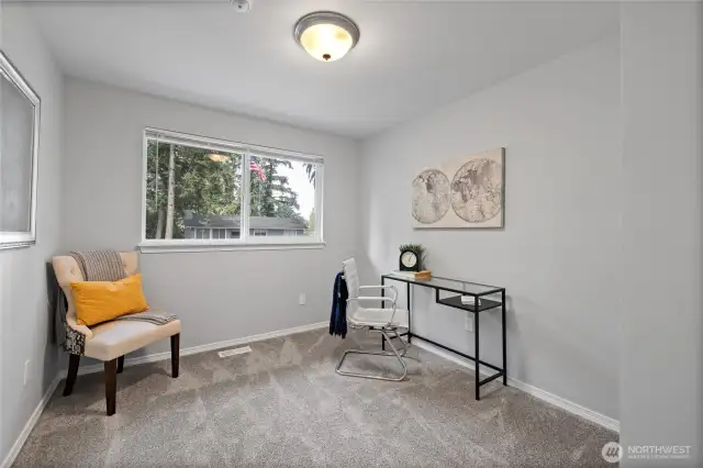 Third of three bedrooms shown as office here.