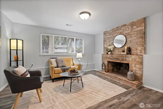 Spacious family room on the lower level complete with wood burning fireplace.