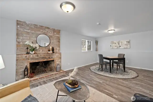 Light and bright modern touches in the lower level with the cozy fireplace make for a welcoming space.