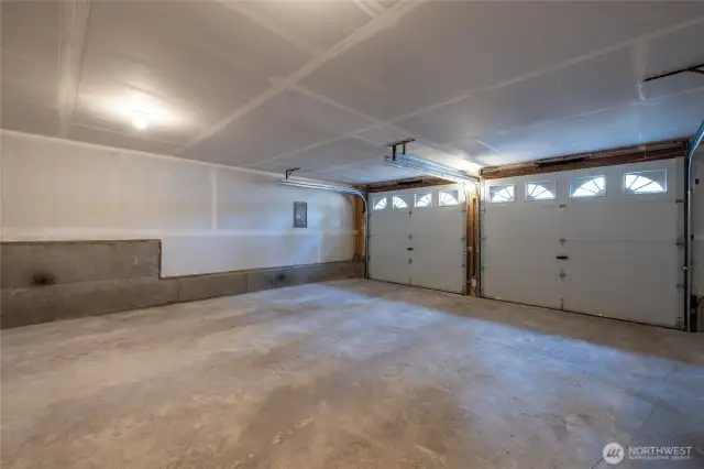 Spacious 2 car garage with all new garage doors. Also the location of the all new water heater & heat pump/furnace