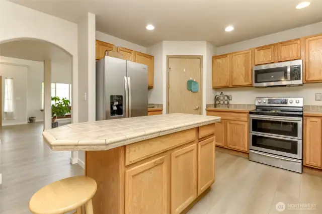 Nice sized island for all your prep needs, walk in pantry, new stainless appliances with double oven (plumed for gas)