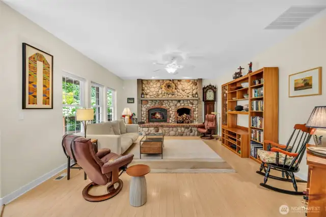 Living room with river rock fireplace.