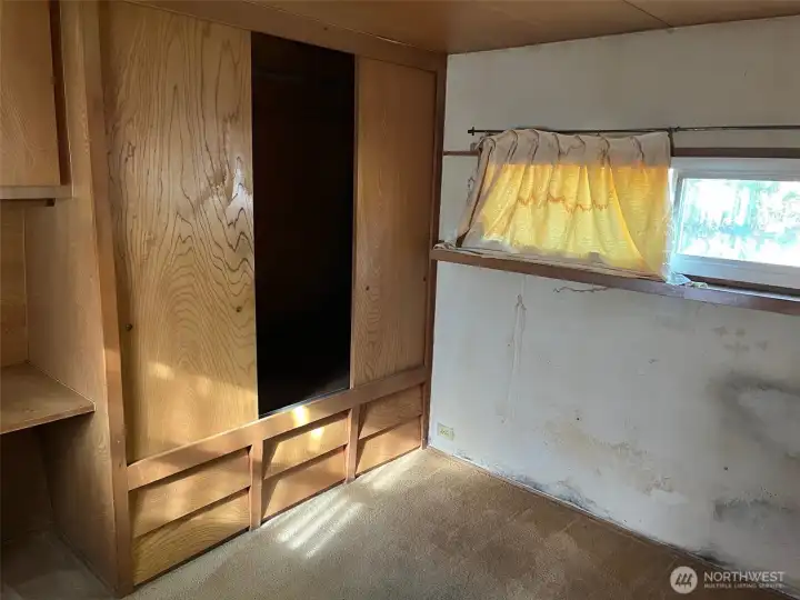 Large built-in armoire storage in bedroom
