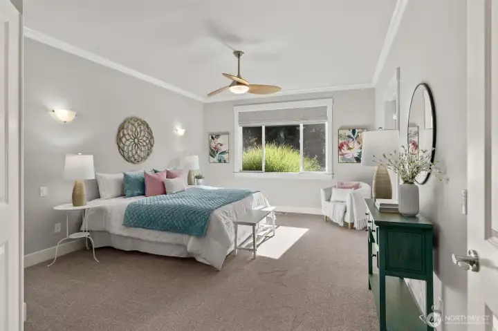 Spacious primary suite with spa-like bath, skylight and walk-in closet.