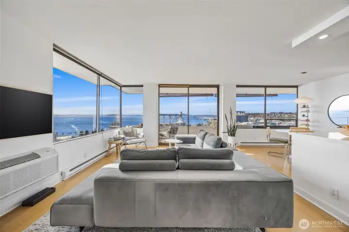 Sweeping views of Elliott Bay / Puget Sound and the Olympic Mountains, often framed with ferry traffic and islands.