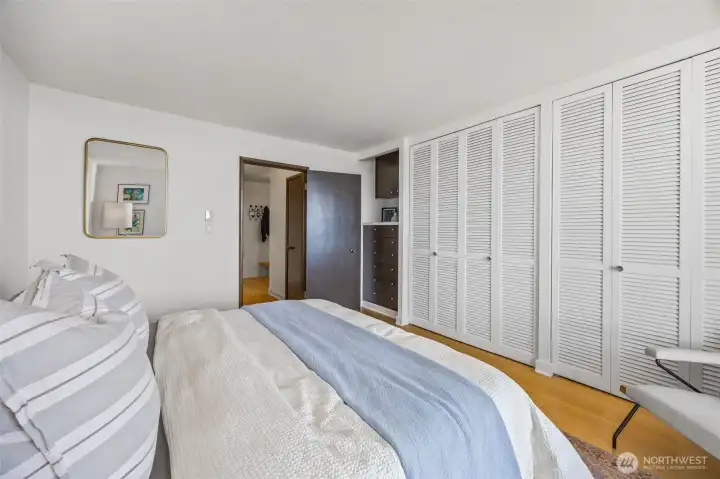 Bedroom with cabinet built-ins and tons of closet space.