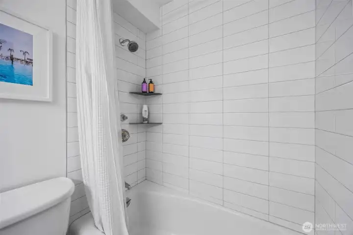 New tile surround continues the modern feel of this 4th floor corner unit.