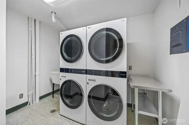 Oversized double washer and dryer located just down hall from unit 402.