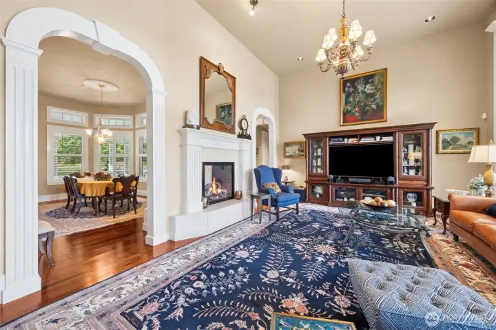 Spacious and gracious formal living room with double-sided gas fireplace