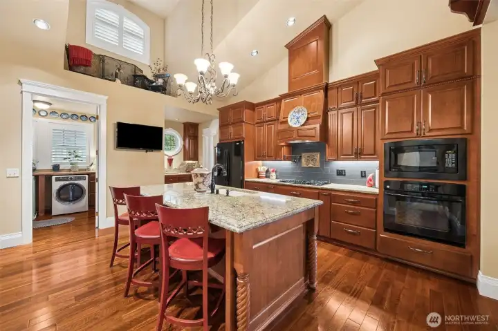 Gourmet kitchen with soaring ceilings