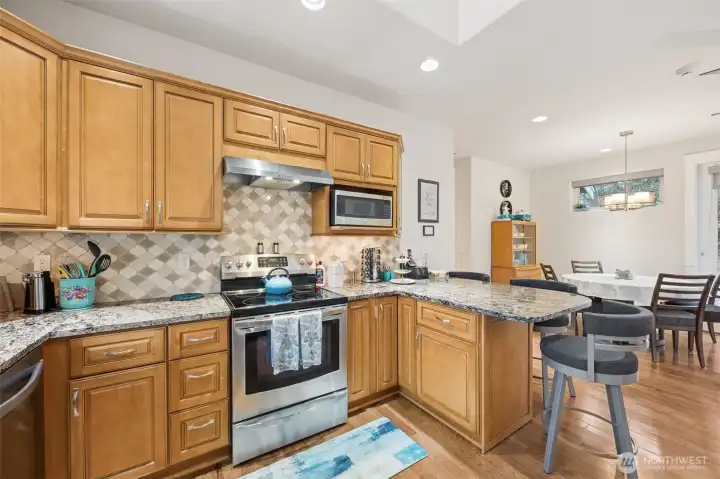 Quartz countertops with tile backsplash