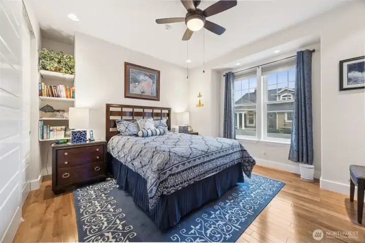 Big guest room with hardwood floors