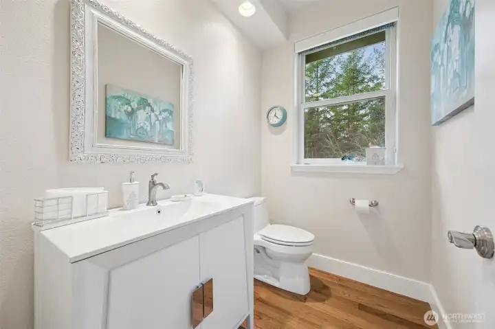 Quartz countertop with hardwood floors.