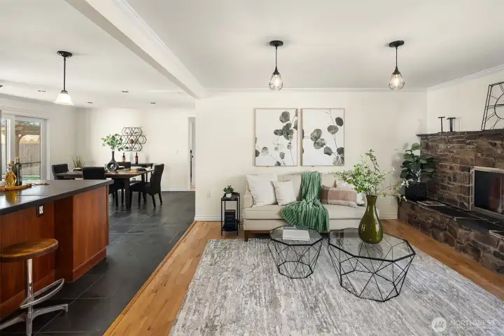 The central great room is the heart of the home, with separate living, dining and kitchen spaces. Refinished hardwood floors and slate flooring compliment one another.