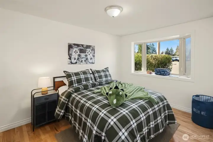 Secondary bedroom at the front of the house with bay window.