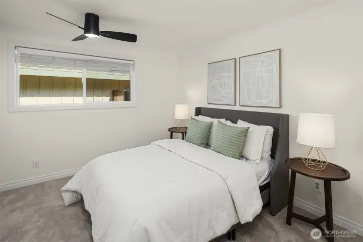 The primary suite with walk in closet and adjacent three quarter bath