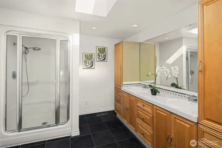 Three quarter bath with double vanities for the primary suite. Lots of storage!