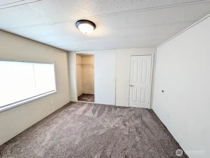 Walk-in closet off primary bedroom.