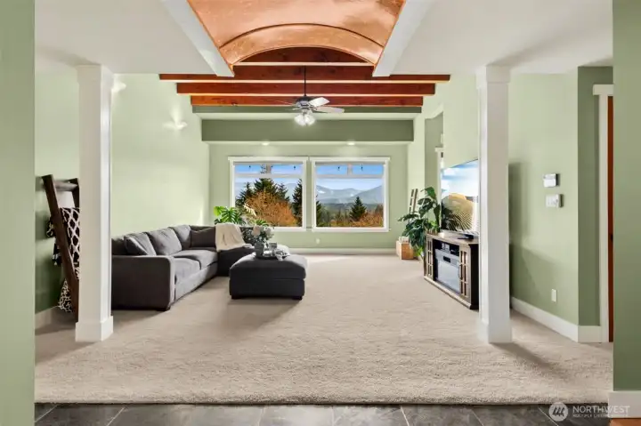 Step in and the first thing you see are the sweeping views of the valley, Cedar River Watershed and Cascade mountains from the entry. Then your attention is drawn to the custom crafted, copper barrel ceiling.