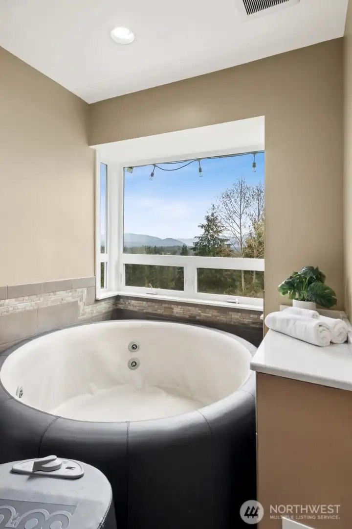 Hot tub can stay or go. Also a great location for a freestanding tub. Imagine these views!