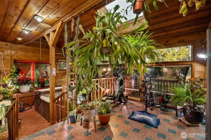 This is the solarium room located on the main floor and has a hot tub that will stay with the property