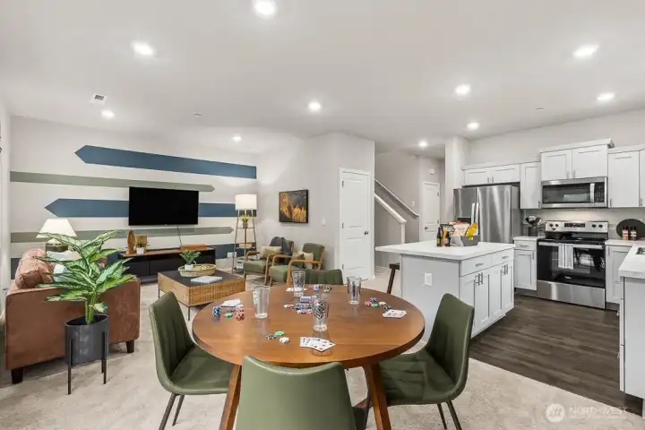 Wide angle from dining to great room and kitchen. Photos are representative only and may display different color package and/or upgrades.