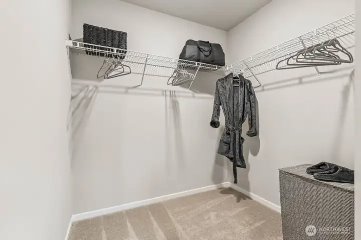 Substantial primary bedroom walk in closet. Photos are representative only and may display different color package and/or upgrades.