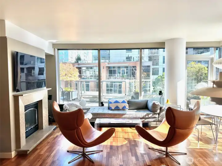 Spacious living area with expansive windows and open layout, perfect for relaxing or entertaining.