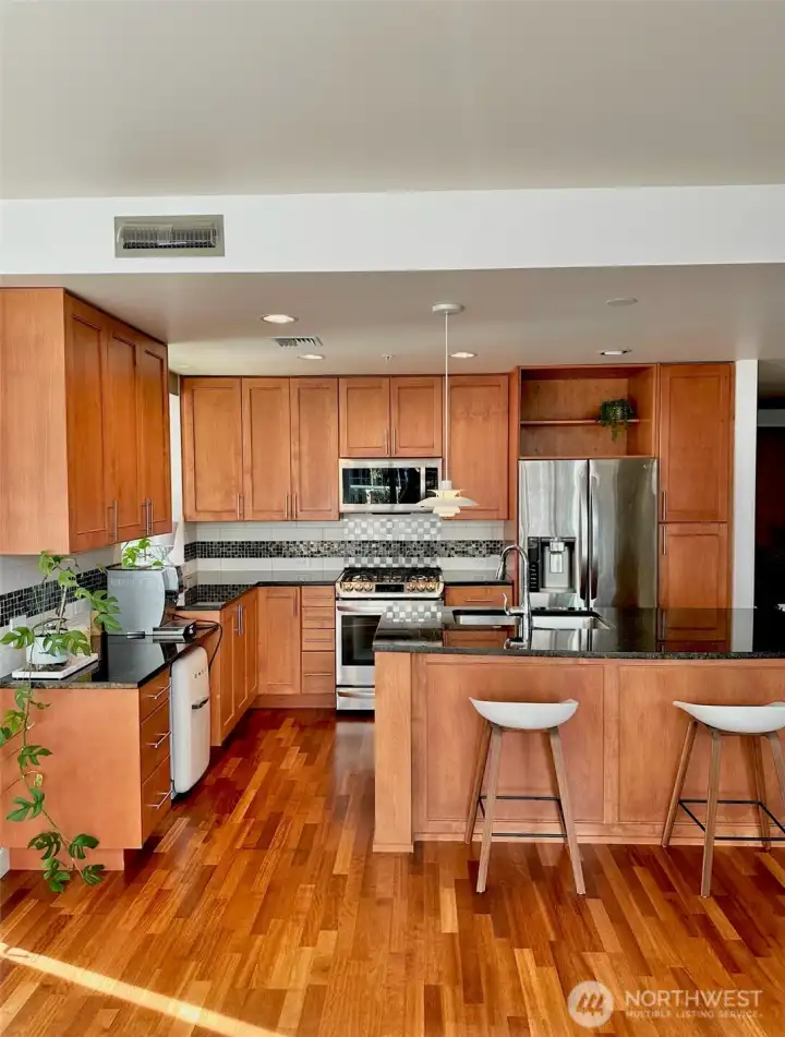 Kitchen with center island and bar seating, ideal for everyday living and entertaining.