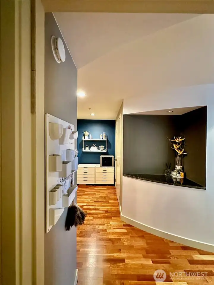 Elegant interior hallway leading to living spaces with modern design touches.