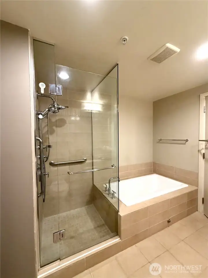 Spa-inspired bathroom with glass-enclosed shower and contemporary finishes.