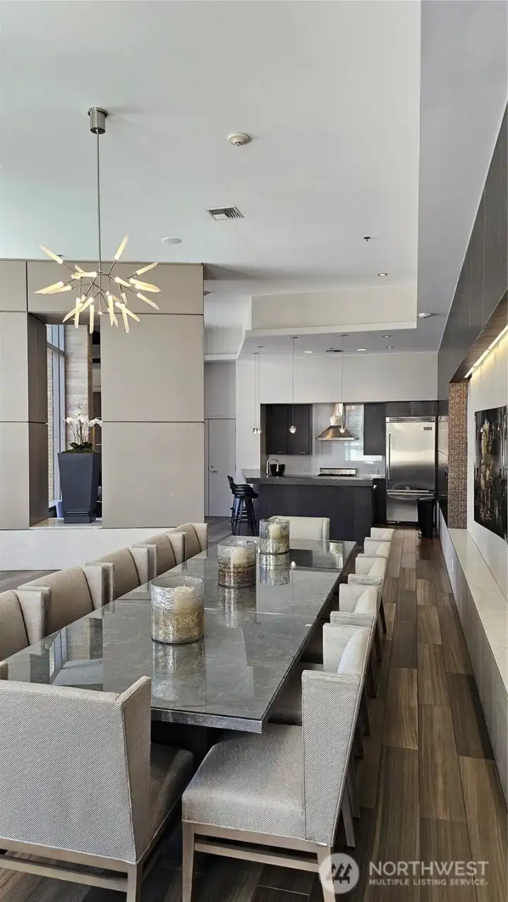 Resident dining or meeting space with modern finishes and seating.