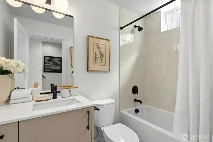 Stylish full bathroom on the lower level.