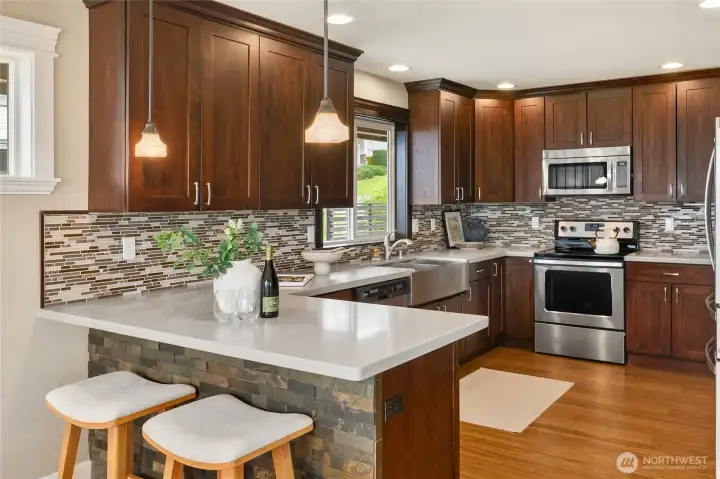 A functional kitchen with ample storage and generous counter space, thoughtfully designed to make cooking both easy and enjoyable.