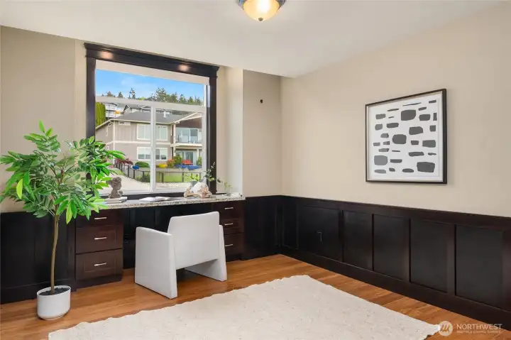 A main-floor office with a built-in desk makes working from home easy and efficient.