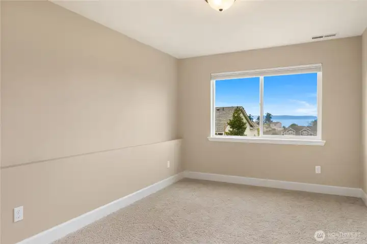 The downstairs additional room offers flexible space—ideal for guests, a home gym, crafting studio, or extra storage.