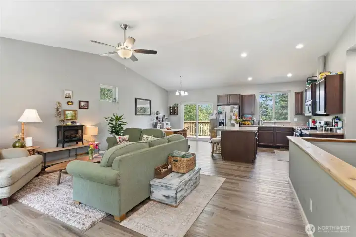 Main floor common area & kitchen w/ vaulted ceilings