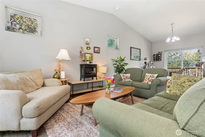 Main floor common area & kitchen w/ vaulted ceilings