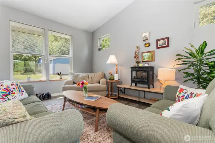 Main floor common area & kitchen w/ vaulted ceilings