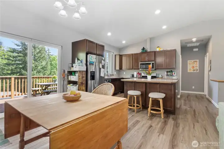Main floor common area & kitchen w/ vaulted ceilings