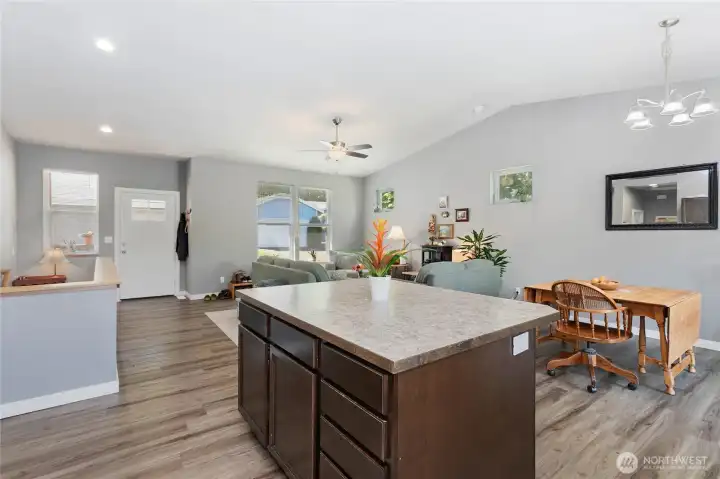 Main floor common area & kitchen w/ vaulted ceilings