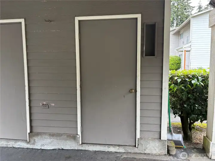 Storage unit on right to left of parking space in carport