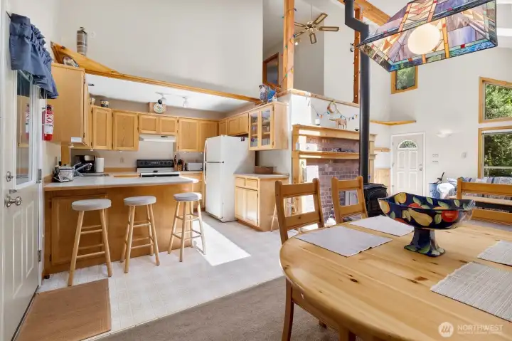 Open kitchen with breakfast bar and convenient prep space.