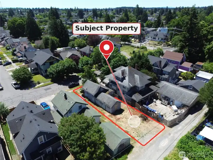 Drone view, looking slight South East from alley. Boundaries approximate, buyer to verify.