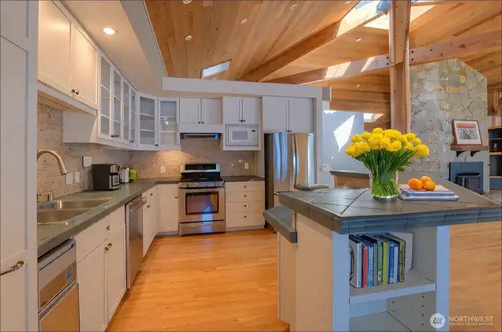 The kitchen flows seamlessly, allows easy prep and entertaining guest - virtually staged